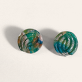 Green marbled round polymer clay studs with parallel curved ridges, front view