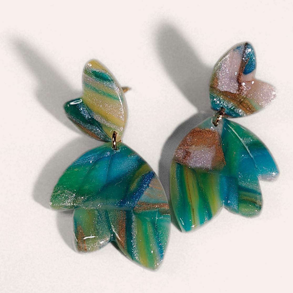 Green & Blue Marble Petal Drop Earrings, angled view showing the pattern