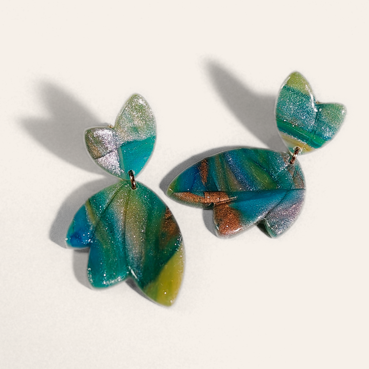 Green & Blue Marble Petal Drop Earrings, angled view showing the pattern