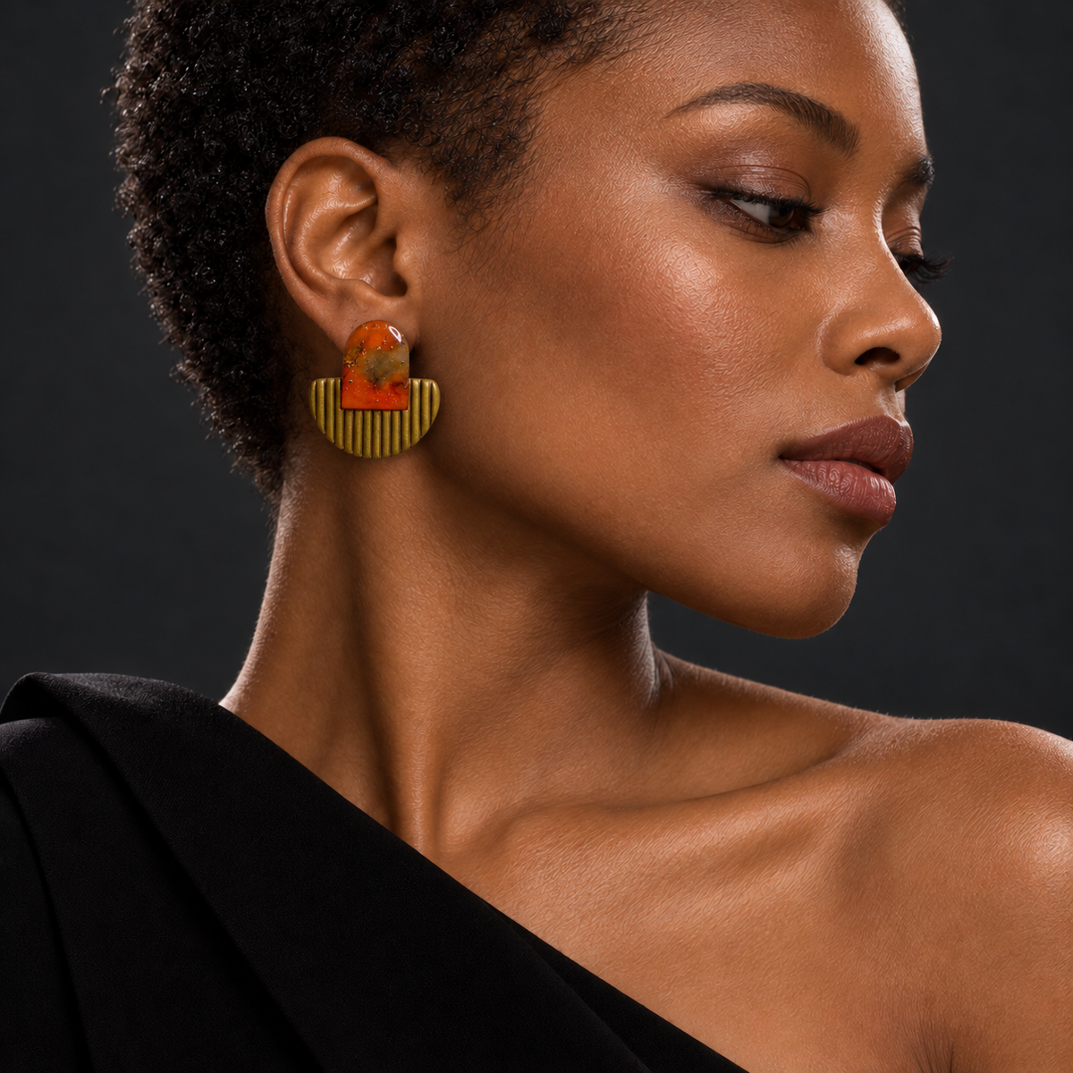 Model wearing ToBe handmade amber polymer clay statement earrings with textured gold base